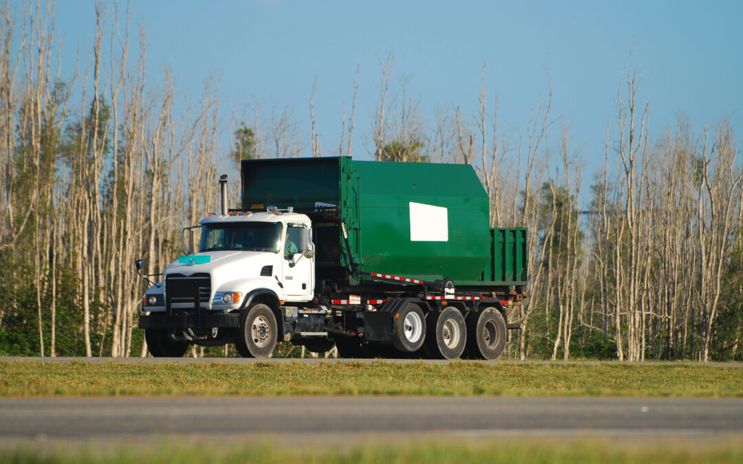 Dump truck carrying chemical sludge from wastewater treatment plant to landfill. Neo Water treatment can help reduce costs related to sludge during phosphorus removal.
